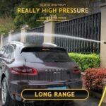 Using high pressure water spray gun to wash car with jet spray
